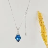 The new S925 sterling silver pendant set with sea blue topaz in the shape of a teardrop pear is a versatile and elegant bride necklace with a gentle smile details Picture